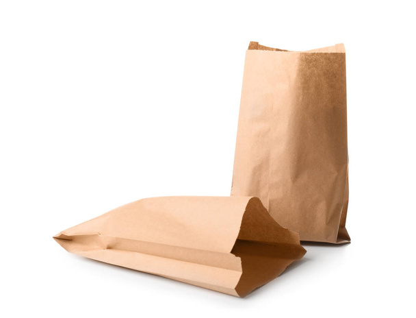 Paper bags on white background. Food delivery service - Photo, Image