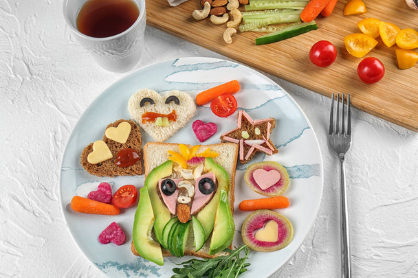 Creative breakfast for children on plate. Recipe ideas with bread - Photo, Image