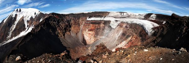 Volcano crater with mountain covered with snow on the background - Фото, изображение