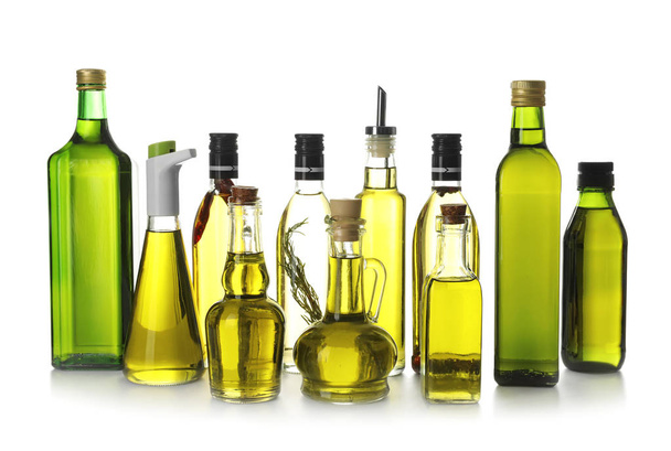 Lasiesineet oliiviöljyllä valkoisella pohjalla
 - Valokuva, kuva