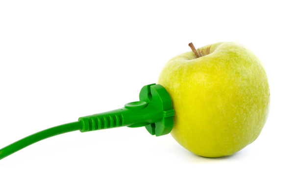 Зелений кабель живлення, прикріплений до розетки яблука
 - Фото, зображення