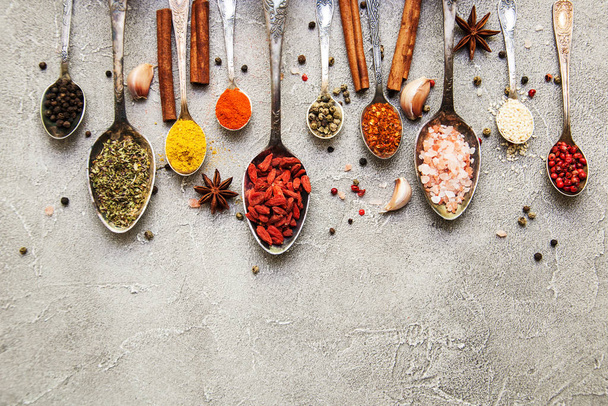 Different kind of spices in vintage spoons - Φωτογραφία, εικόνα