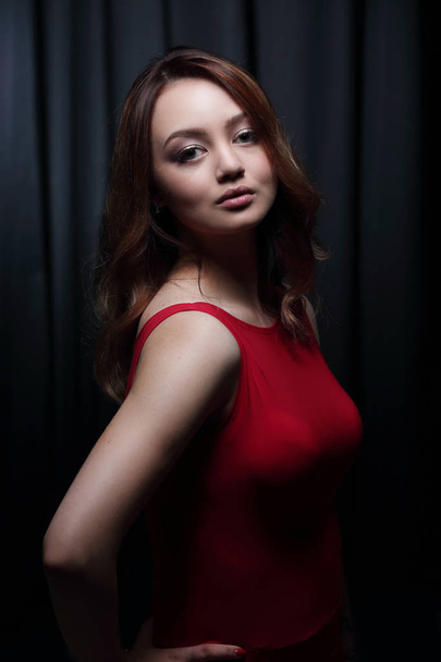 Fashionable young beautiful woman in a red dress - Fotó, kép