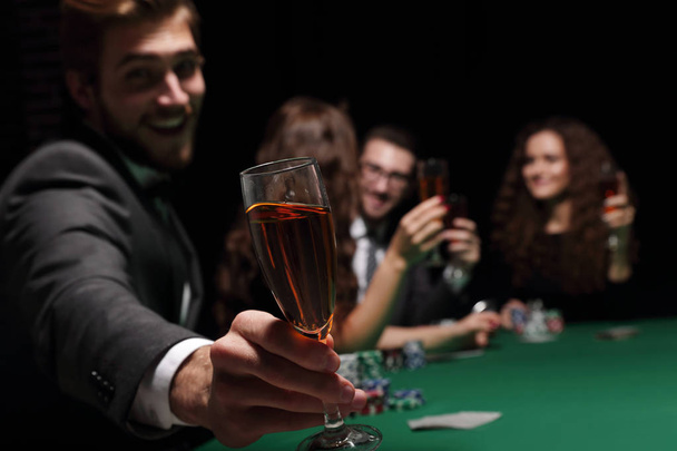 poker player with a glass of wine - Foto, Imagen