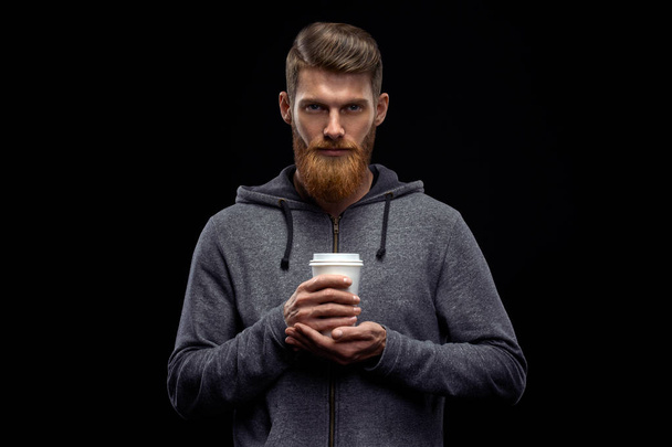 Bearded stylish man with cup of coffee - Фото, изображение