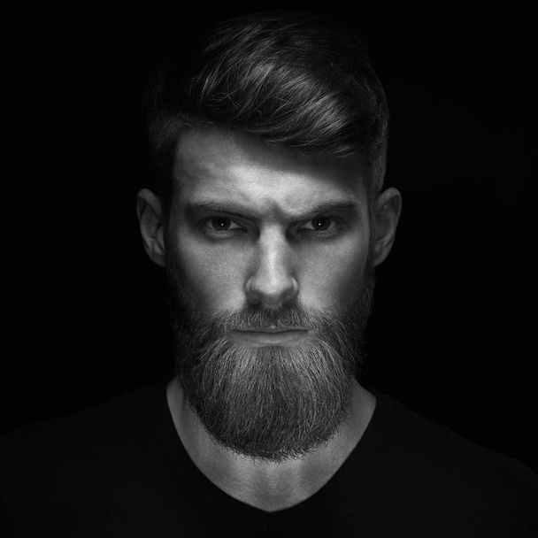 Brutal bearded man in a black T-shirt - Photo, Image