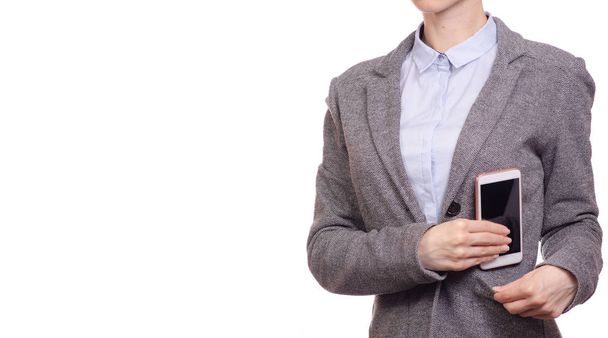 Kadın iş gömlek ve ceket cebine bir cep telefonu akıllı telefon koymak. - Fotoğraf, Görsel