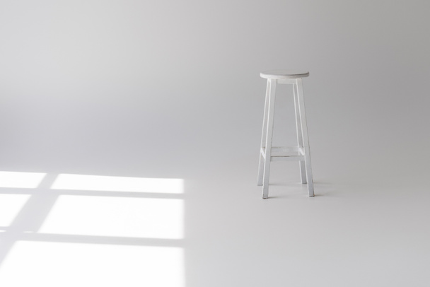single empty modern white stool on grey - Photo, Image