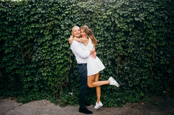 Beautiful young  couple hugging  outdoors - Zdjęcie, obraz