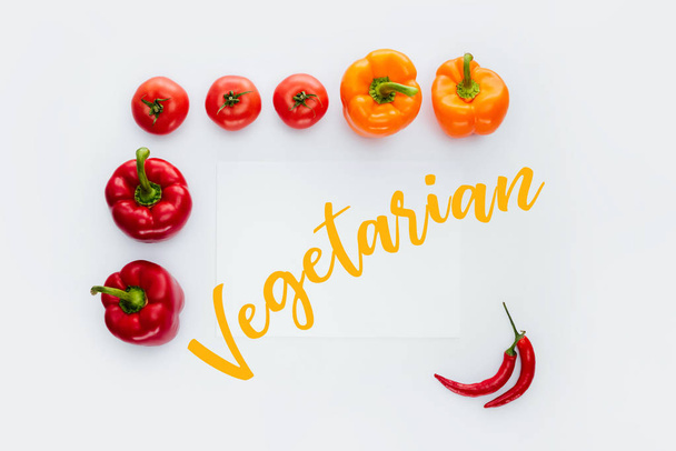 top view of frame of vegetables with text Vegetarian isolated on white - Photo, Image