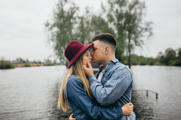 Young fashion couple kissing  outdoors - 写真・画像