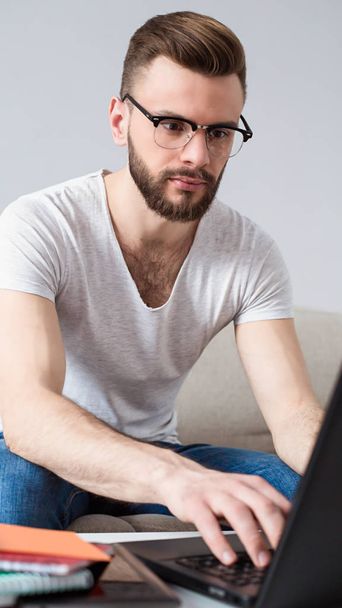 man freelancer using laptop at home  - Zdjęcie, obraz