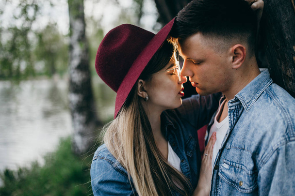 Young fashion couple kissing outdoors - Photo, Image