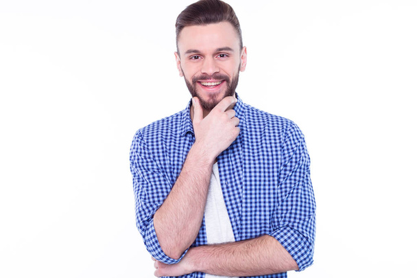 young handsome man posing against white in blue shirt  - Fotografie, Obrázek