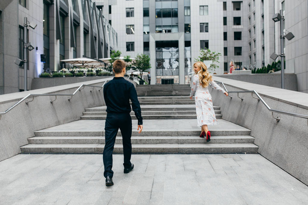 young beautiful couple walking  in  city  - 写真・画像