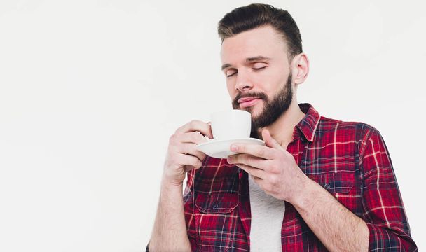 young handsome man drinking coffee  - Fotoğraf, Görsel