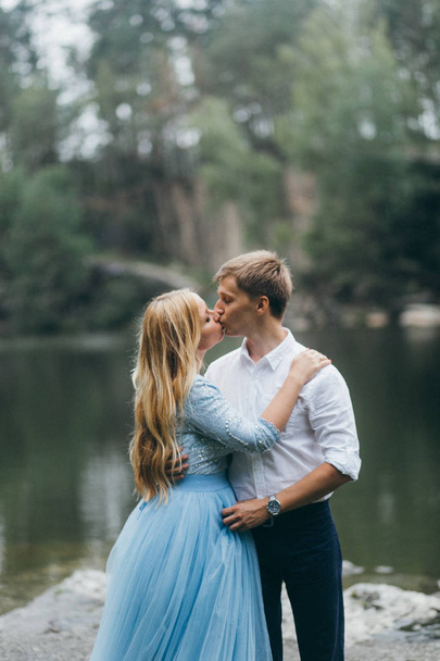 Beautiful young  couple in summer park kissing - Fotografie, Obrázek