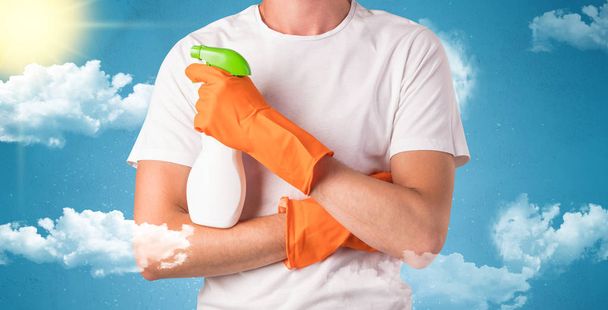 Sunny concept with housekeeper and orange gloves - Foto, Imagen