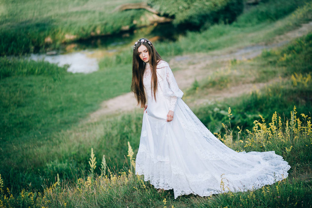 young  beautiful  bride posing outdoors - Fotó, kép