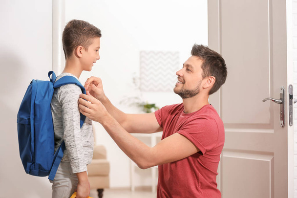 Young man saying goodbye to his son before school - Photo, Image