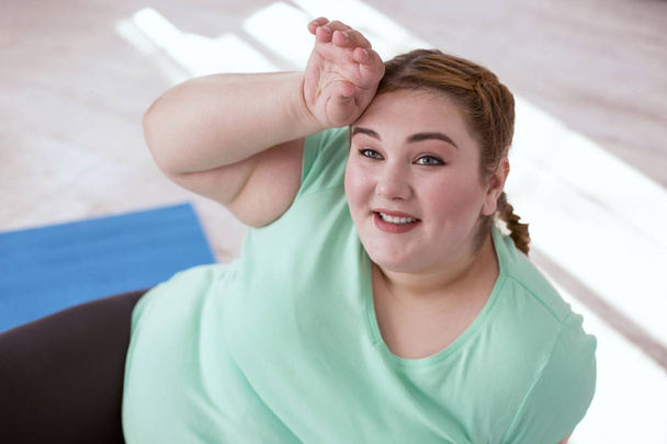 Obese young woman smiling after workout - 写真・画像