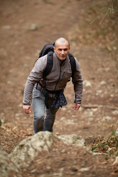 Hiker with backpack on a trail - 写真・画像