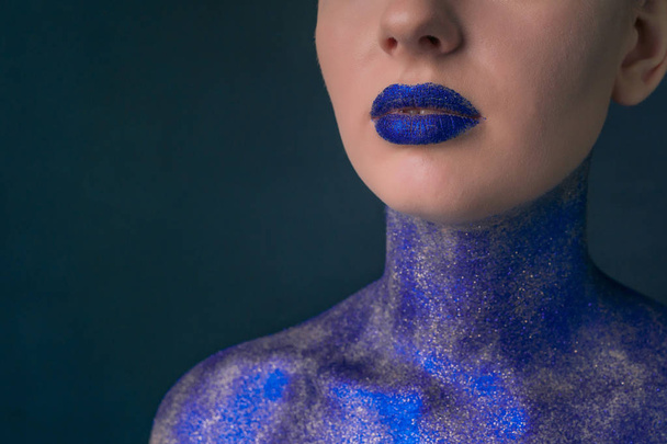 Close-up of a girls lips and shoulders covered with sparkles - Valokuva, kuva