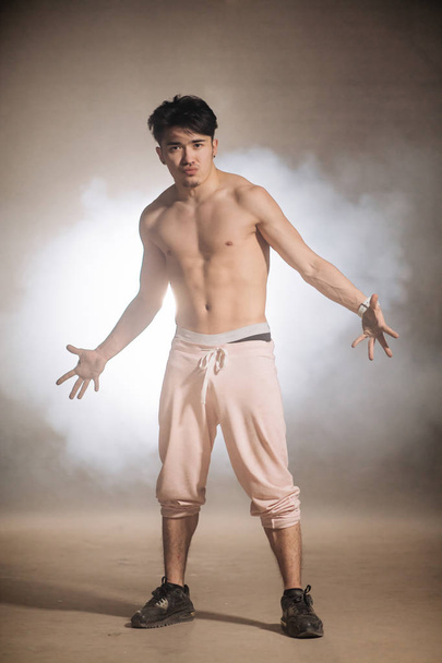 agressive confident Asian man with dark skin standing nacked to the waist - Valokuva, kuva