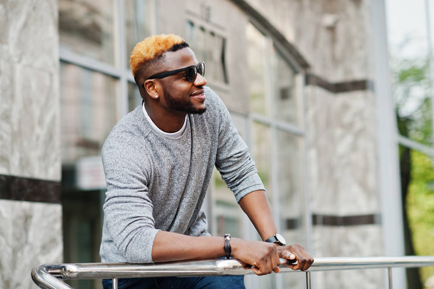 Stylish african american boy on gray sweater and black sunglasse - Foto, immagini
