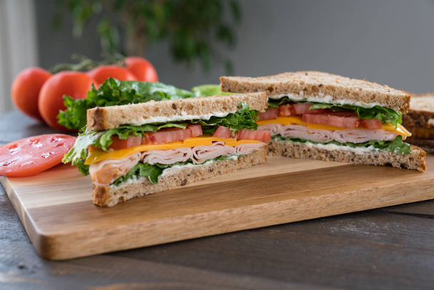 Turkey Sandwich on a Cutting Board - Fotoğraf, Görsel