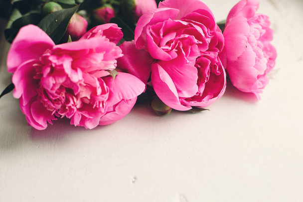 beautiful pink peonies bouquet on rustic white background - Фото, зображення