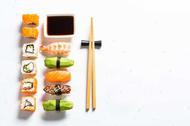 Sushi and sushi roll set on white background. - Foto, afbeelding