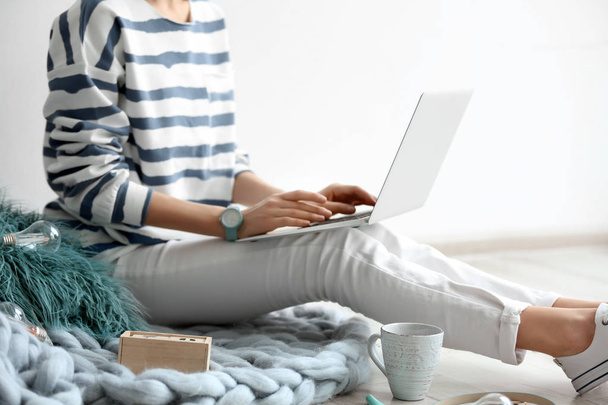 Female blogger with laptop indoors - Fotó, kép