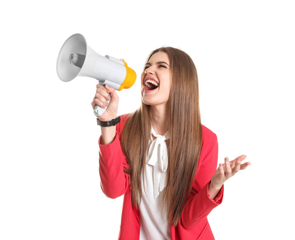 Young woman shouting into megaphone on white background - Φωτογραφία, εικόνα