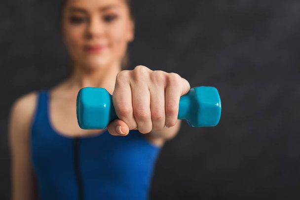 Fitness woman making exercise with dumbbells - Photo, Image