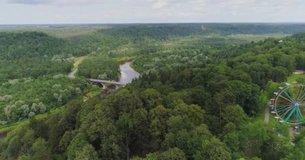 Bridge in Sigulda city Forest, nature, Gauja river drone flight, bridge car drive from above - Πλάνα, βίντεο