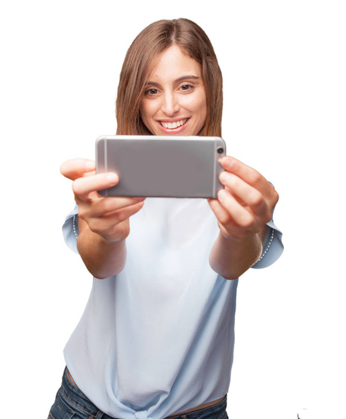 young pretty woman with a smartphone - Photo, Image