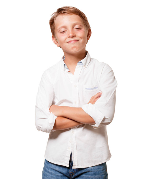 young blonde boy, satisfied expression over white background - Foto, Bild
