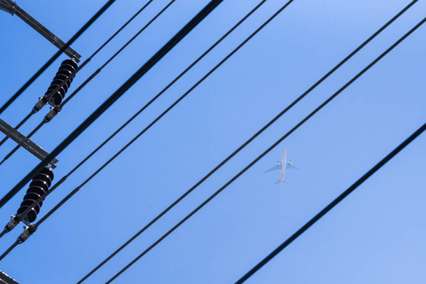 Airplane and electric wire.Thailand. - Photo, Image