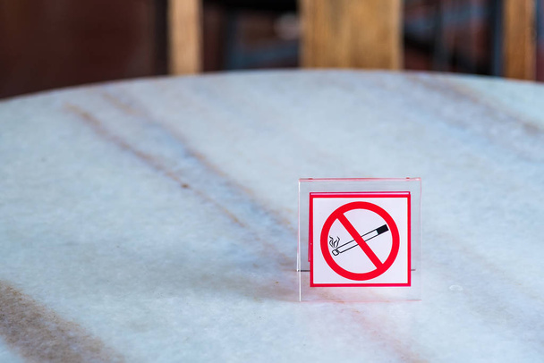 Do not smoke sign on table.Thailand. - Photo, Image