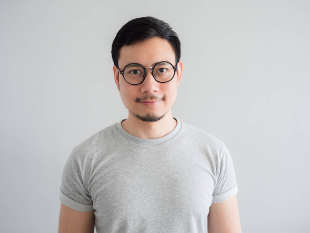 Normal face of ordinary Asian man with eyeglasses. - Photo, image