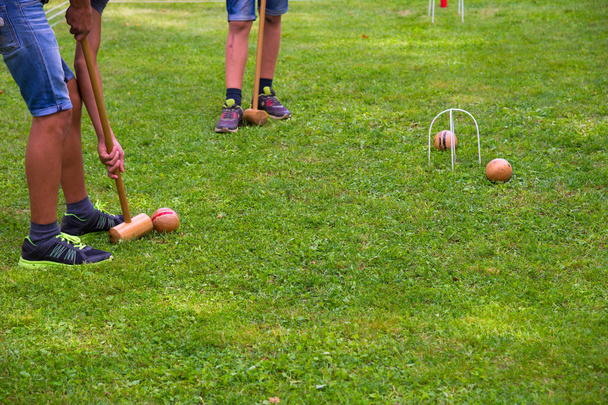 Children playing croquet in summer - Fotó, kép