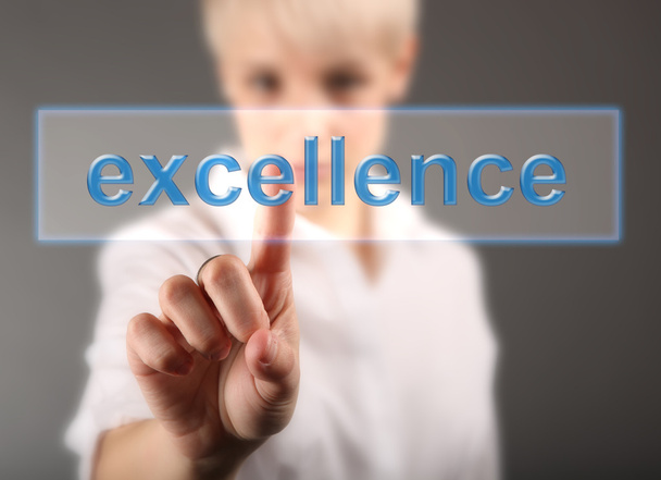 Business woman touching screen with Excellence sign - finance concept - Photo, Image