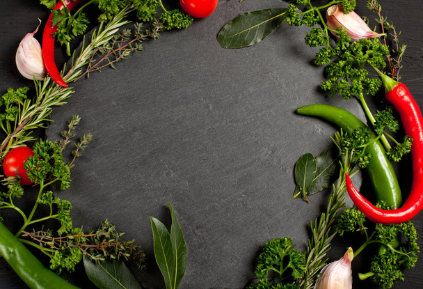 Fresh ingredients for healthy cooking on black stone slate board, top view, banner. Diet or vegetarian food concept - Photo, Image