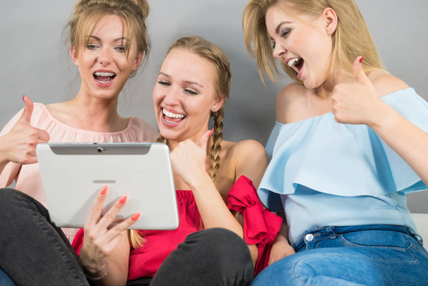Three women using tablet - Valokuva, kuva