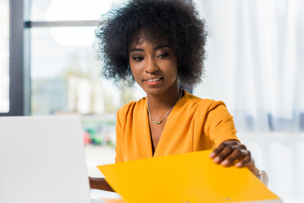 smiling african american freelancer at workplace at home - Photo, image