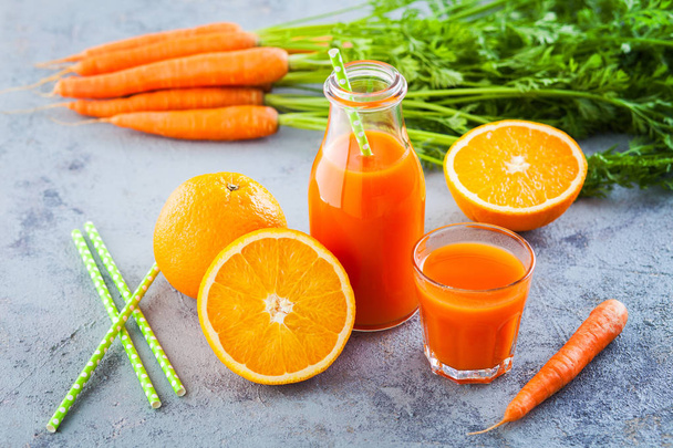 carrot and orange fresh juice on grey table  - food and drink - Photo, Image