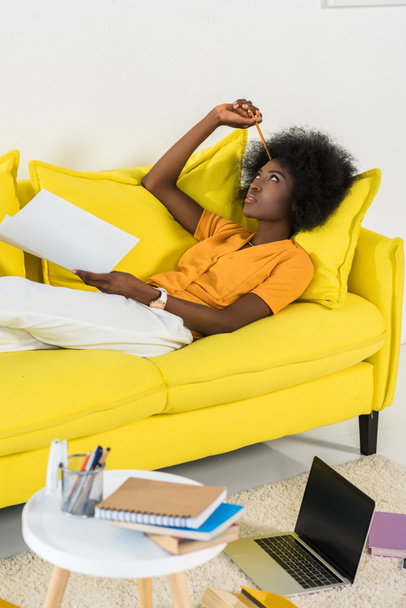 pensive african american woman with papers remote working at home - Photo, Image