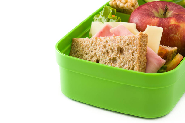 Здоровый школьный обед: Сэндвич, овощи, фрукты и сок на белом фоне
 - Фото, изображение
