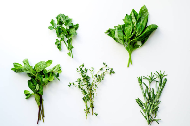 bunches of rosemary with thyme and mint with basil and parsley herbs isolated on white background, close-up  - Φωτογραφία, εικόνα